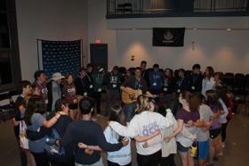 Group of people celebrating on stage