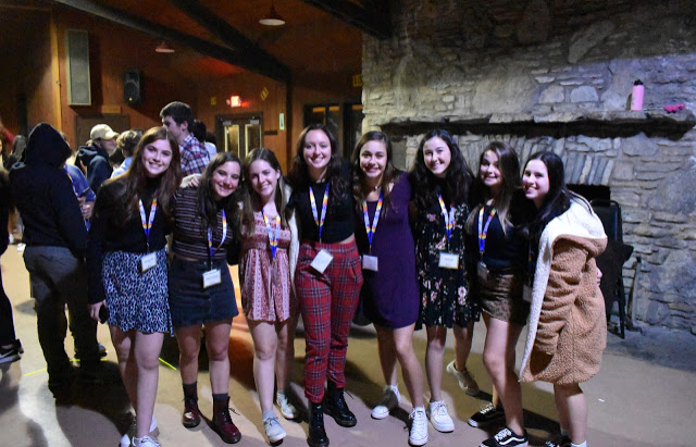 Group of people celebrating on stage