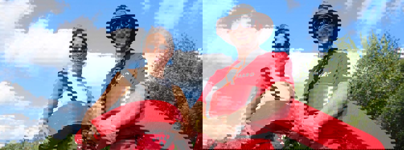 Group of diverse young people smiling at a community event