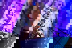 Group of people celebrating on stage