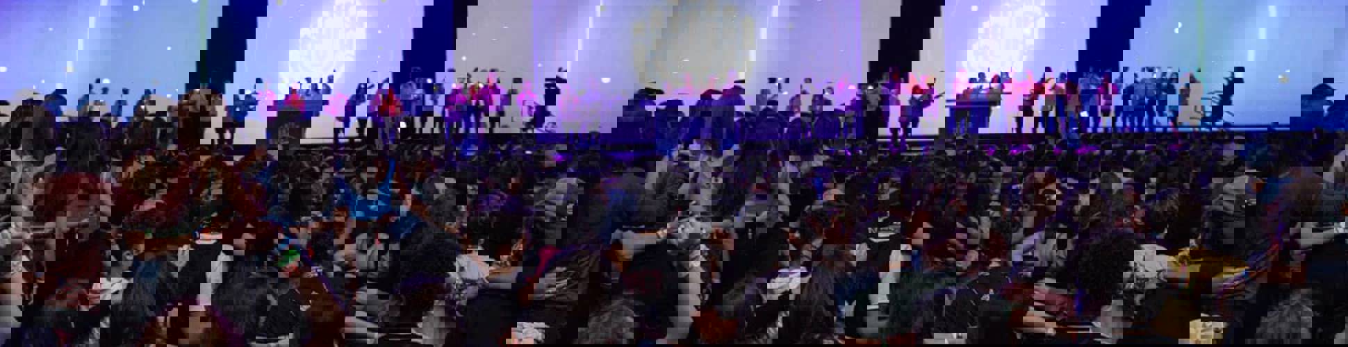 Group of diverse young people smiling at a community event