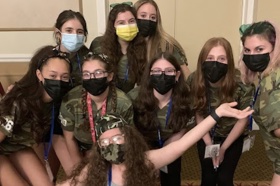 Group of people celebrating on stage