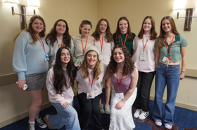 Group of people celebrating on stage