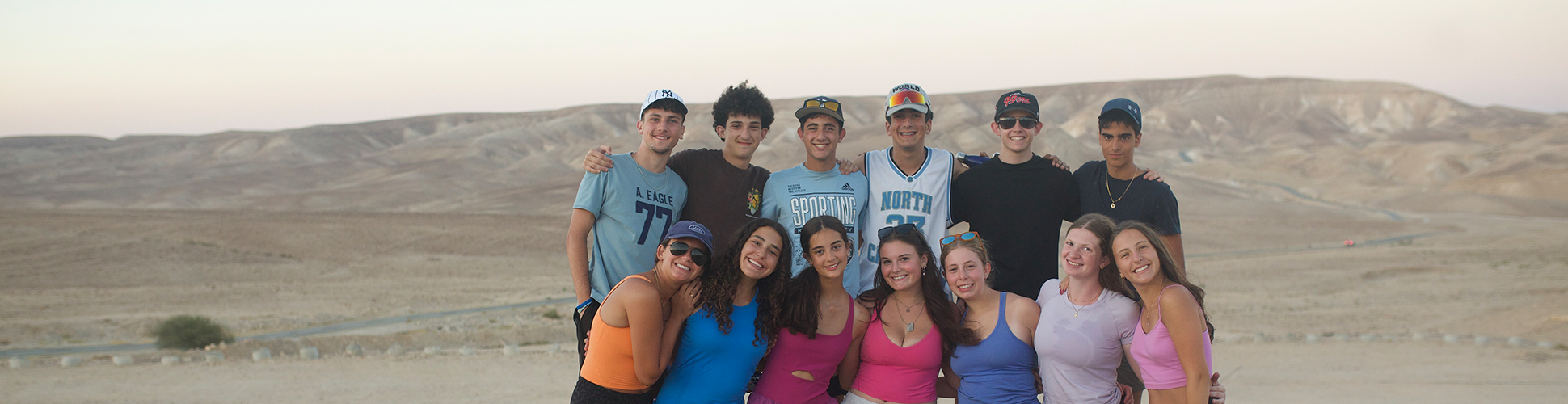 Group of diverse young people smiling at a community event