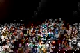 Group of people celebrating on stage