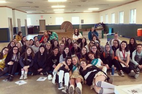 Group of people celebrating on stage