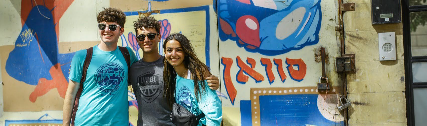 Group of diverse young people smiling at a community event