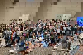 Group of people celebrating on stage