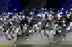 Group of people celebrating on stage