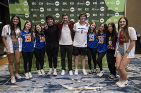 Group of people celebrating on stage