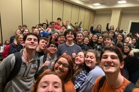 Group of people celebrating on stage