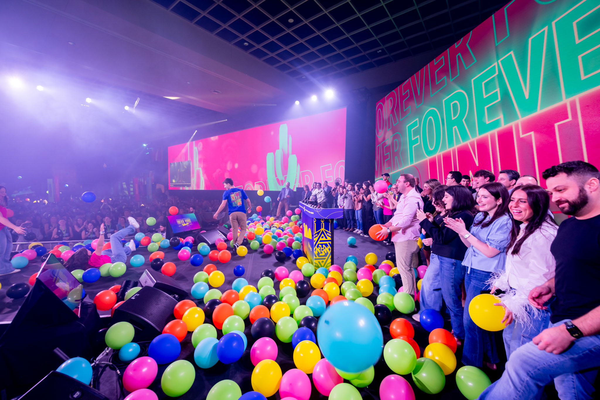 Group of people celebrating on stage