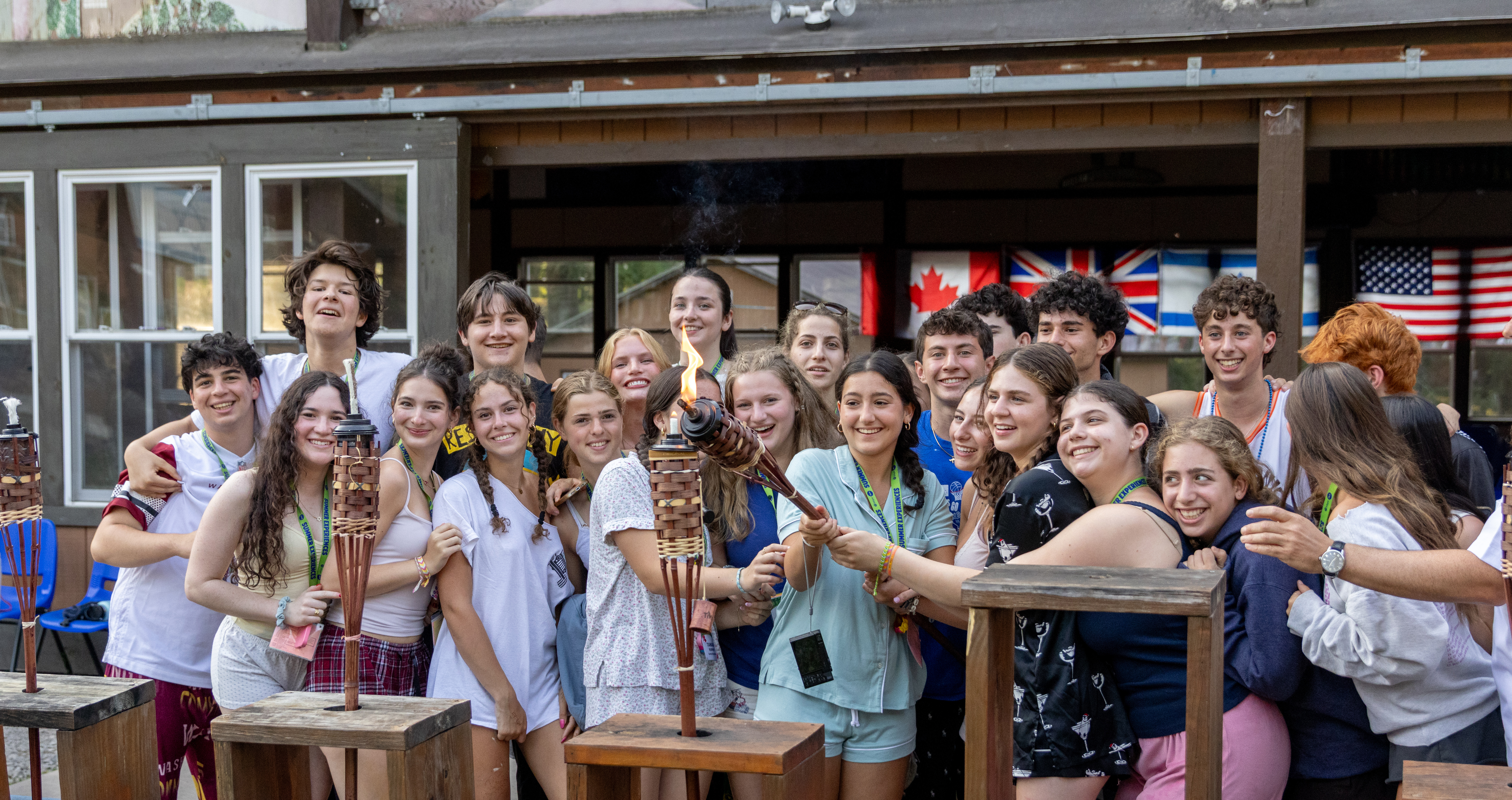 Group of diverse young people smiling at a community event