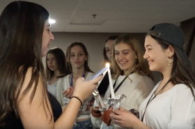 Group of people celebrating on stage