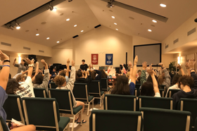 Group of people celebrating on stage