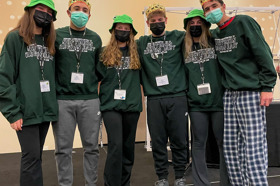 Group of people celebrating on stage