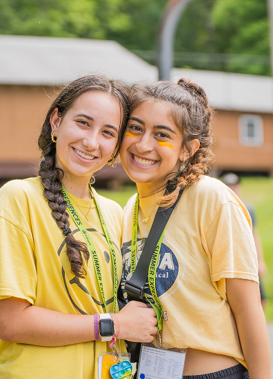 BBYO Centennial celebration with confetti, lights, and a crowd of attendees