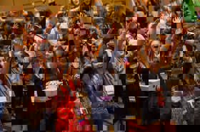 Group of people celebrating on stage