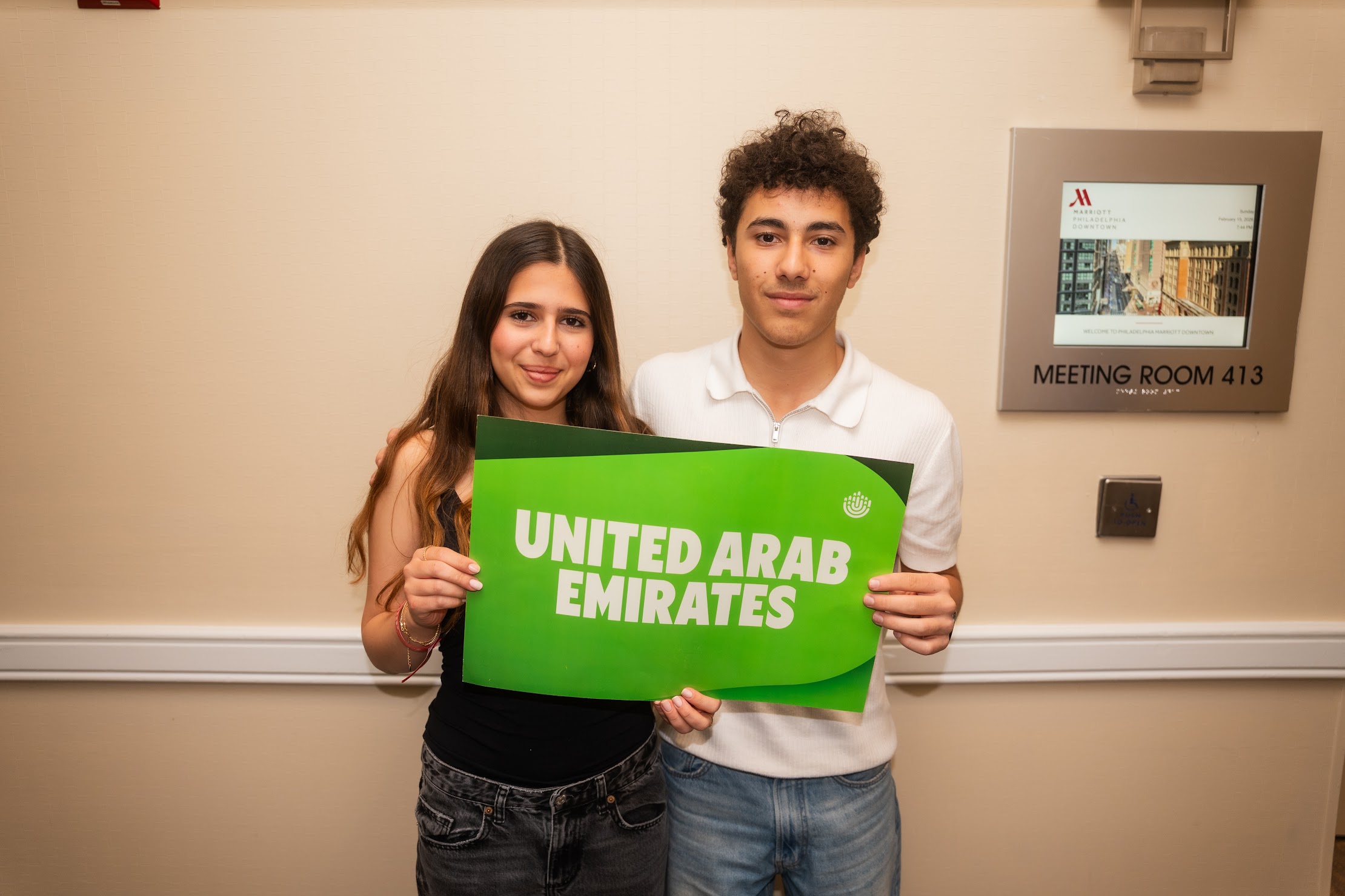 Group of diverse young people smiling at a community event
