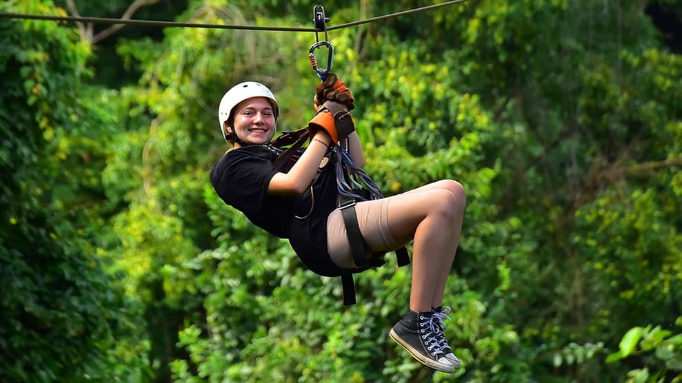 Three friends sitting on a hammock