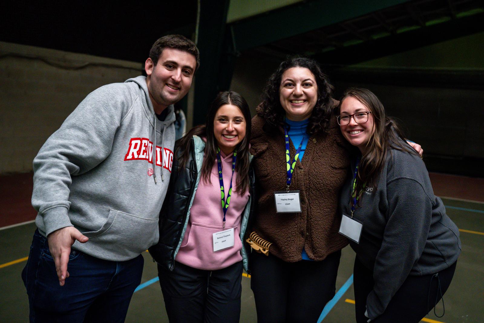 Group of diverse young people smiling at a community event