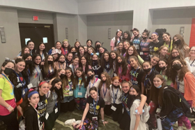 Group of people celebrating on stage