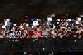 Group of people celebrating on stage