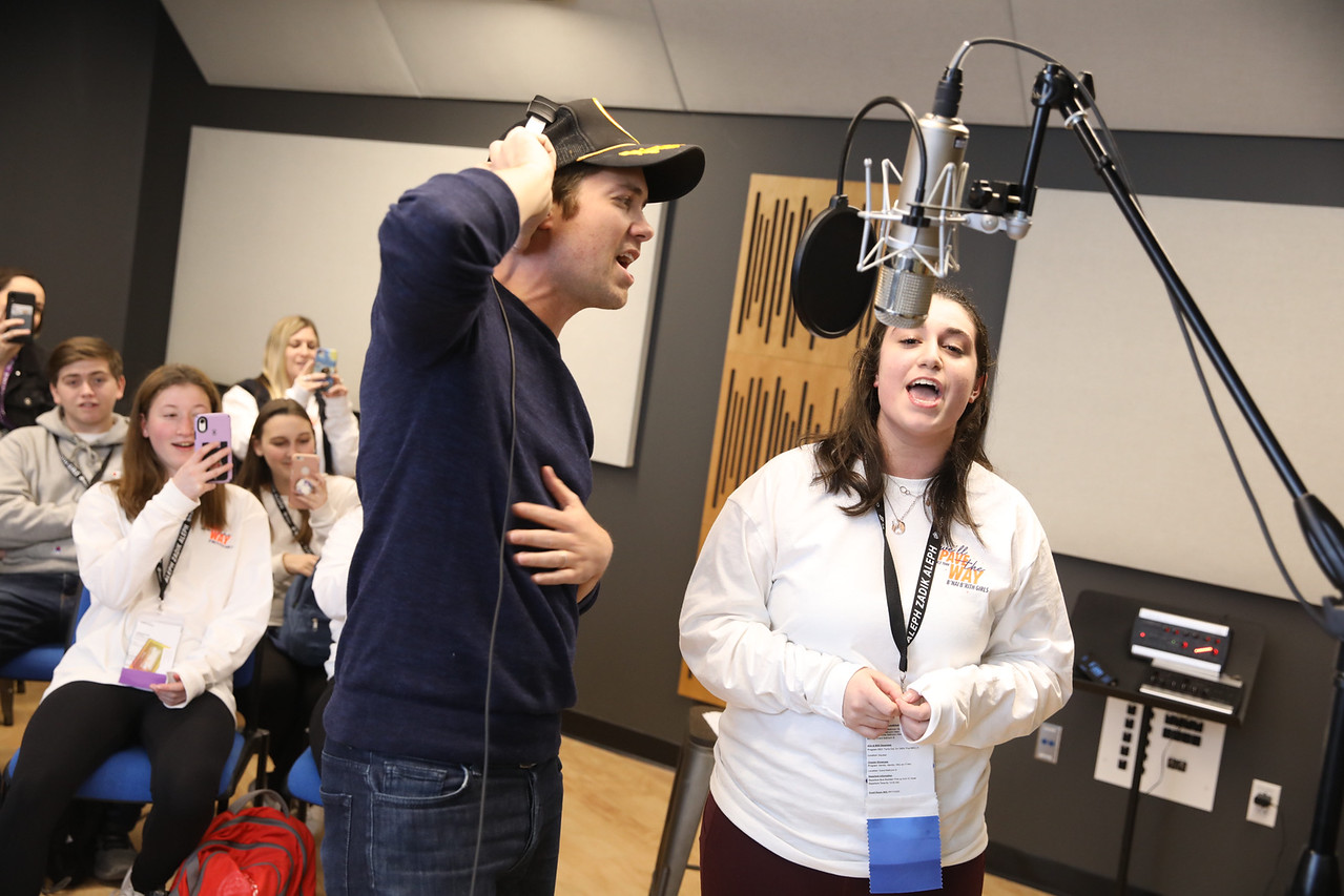 Group of people celebrating on stage
