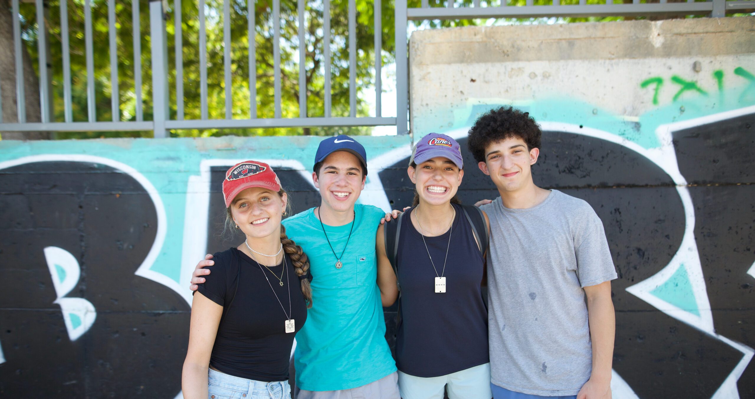 Group of diverse young people smiling at a community event