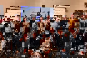 Group of people celebrating on stage