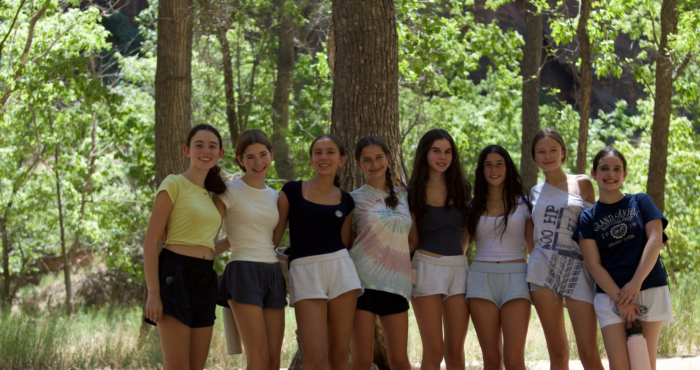 Group of diverse young people smiling at a community event