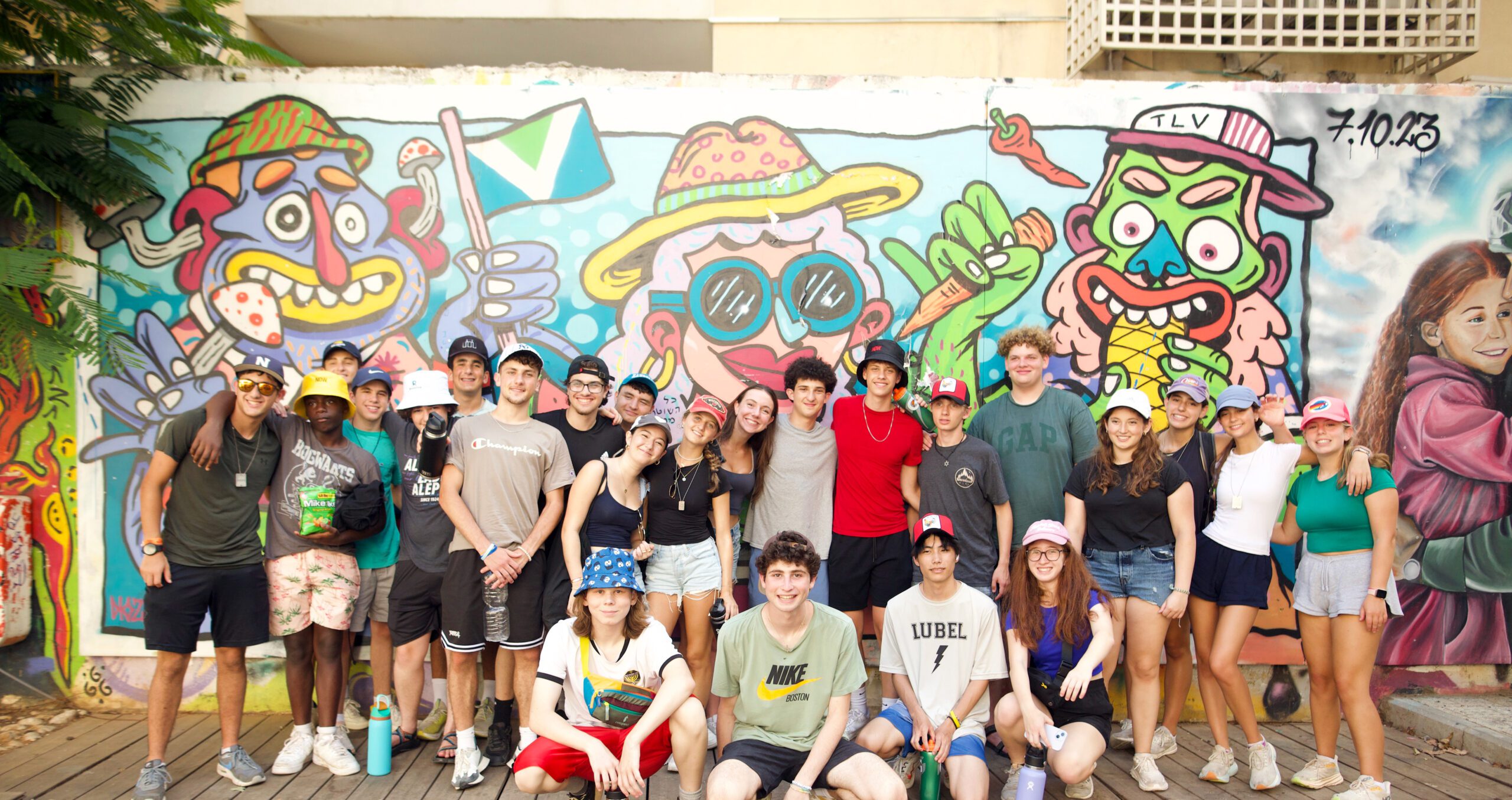 Group of diverse young people smiling at a community event