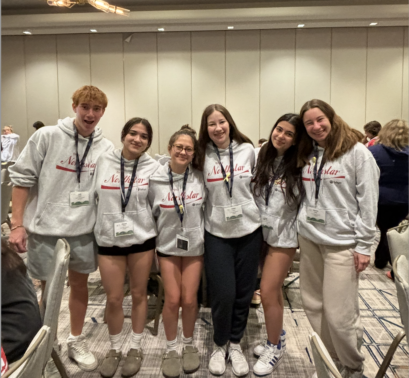 Group of people celebrating on stage
