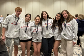 Group of people celebrating on stage