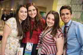 Group of people celebrating on stage