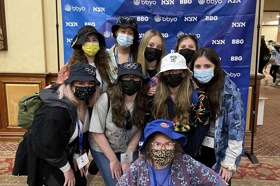 Group of people celebrating on stage