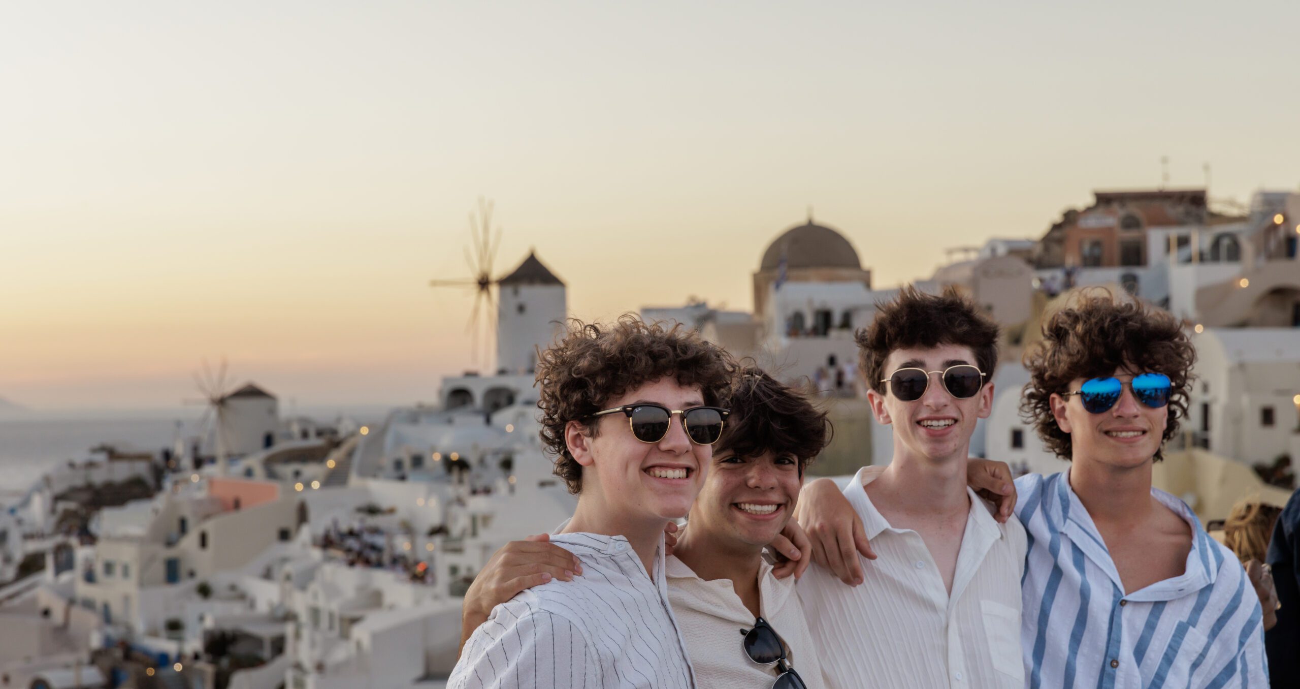 Group of diverse young people smiling at a community event
