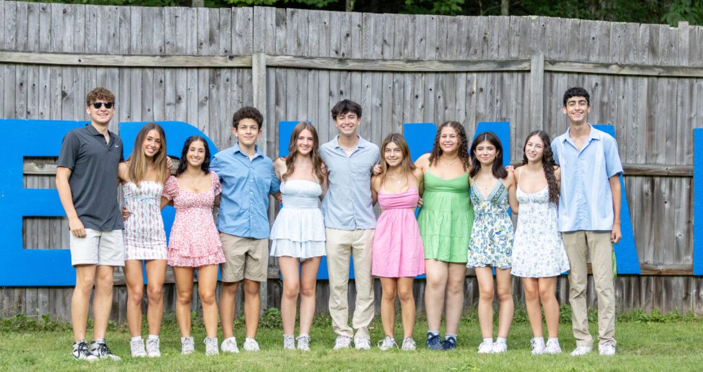 Group of diverse young people smiling at a community event