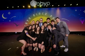 Group of people celebrating on stage