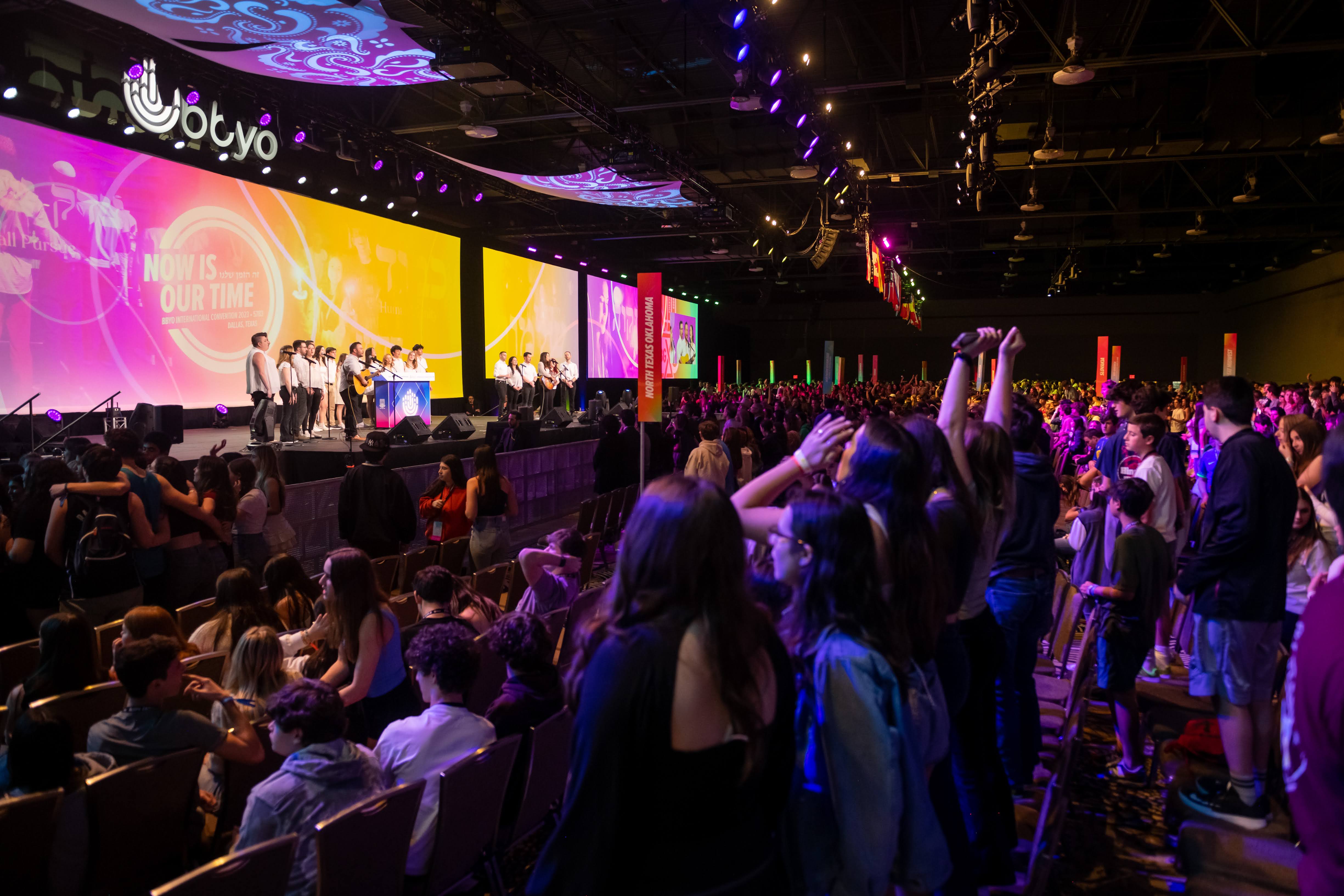 Group of people celebrating on stage