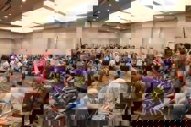 Group of people celebrating on stage