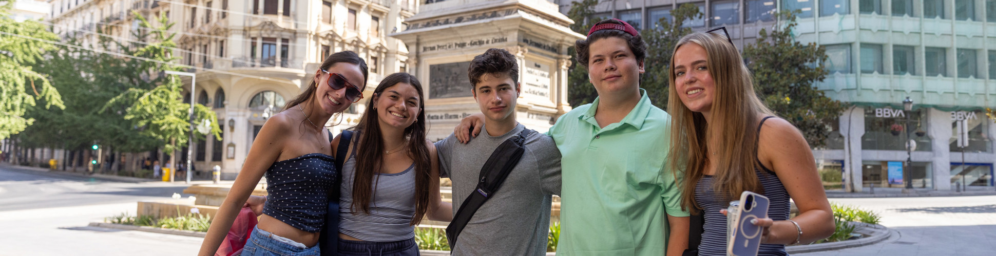 Group of diverse young people smiling at a community event