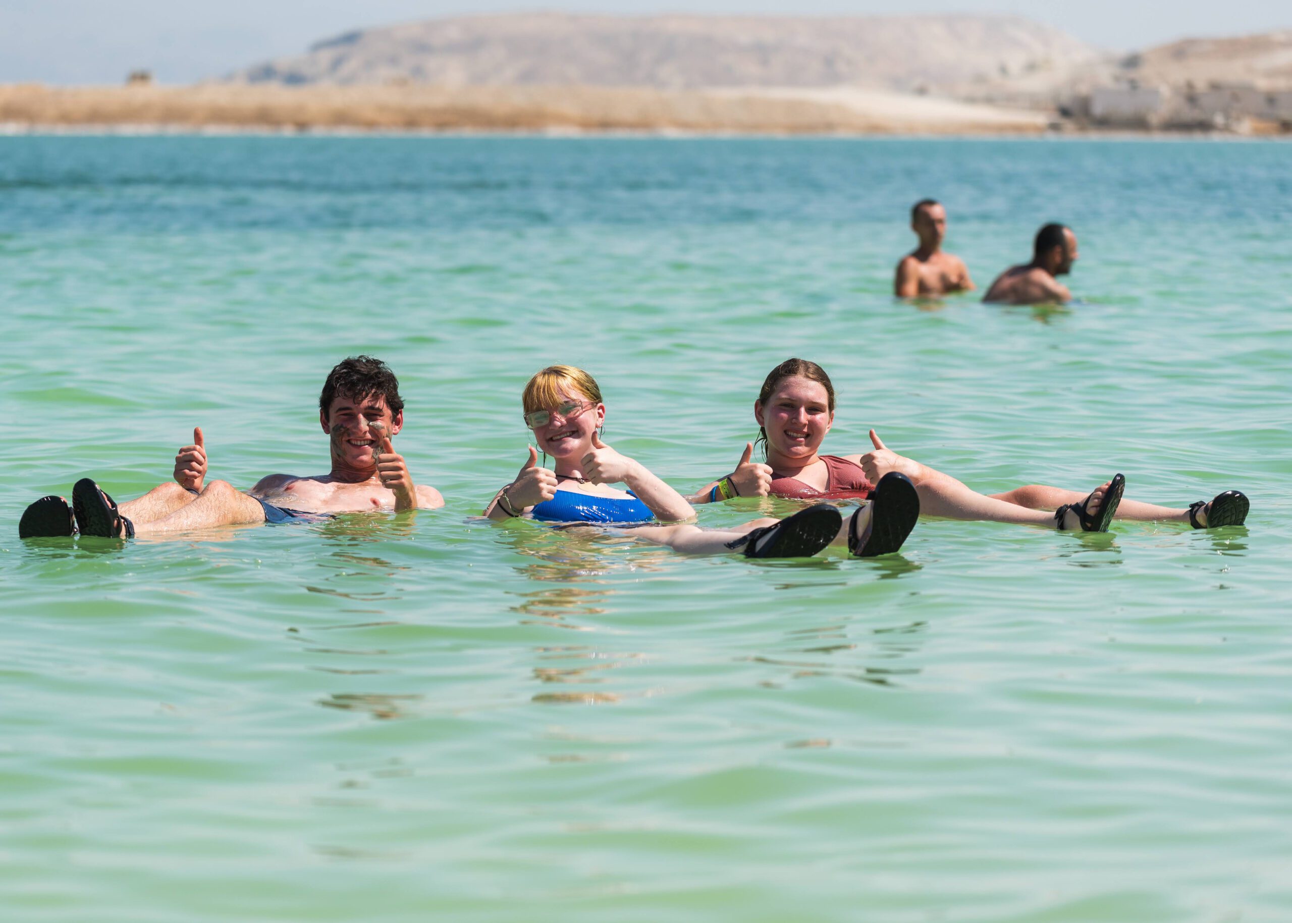 Group of people smiling outdoors