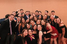 Group of people celebrating on stage