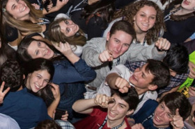 Group of people celebrating on stage