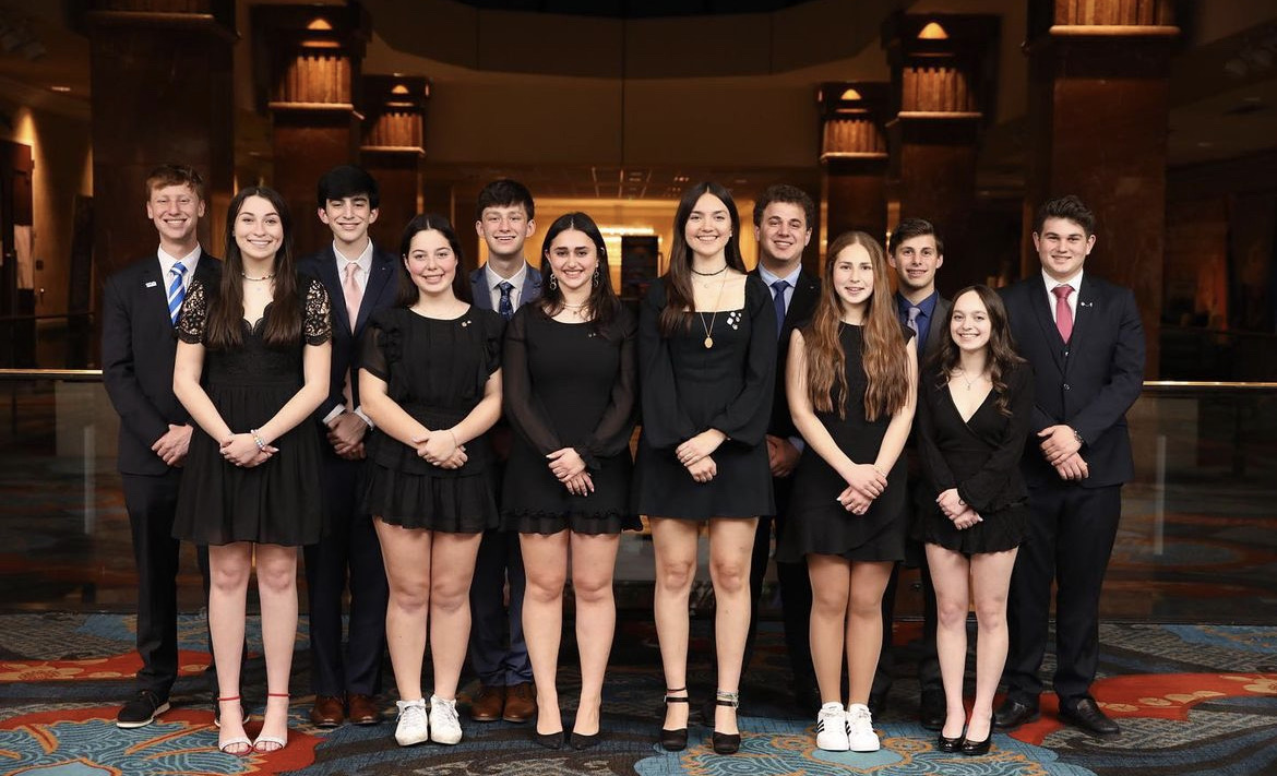 Group of people celebrating on stage