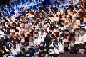 Group of people celebrating on stage