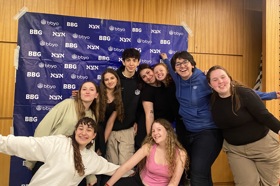 Group of people celebrating on stage