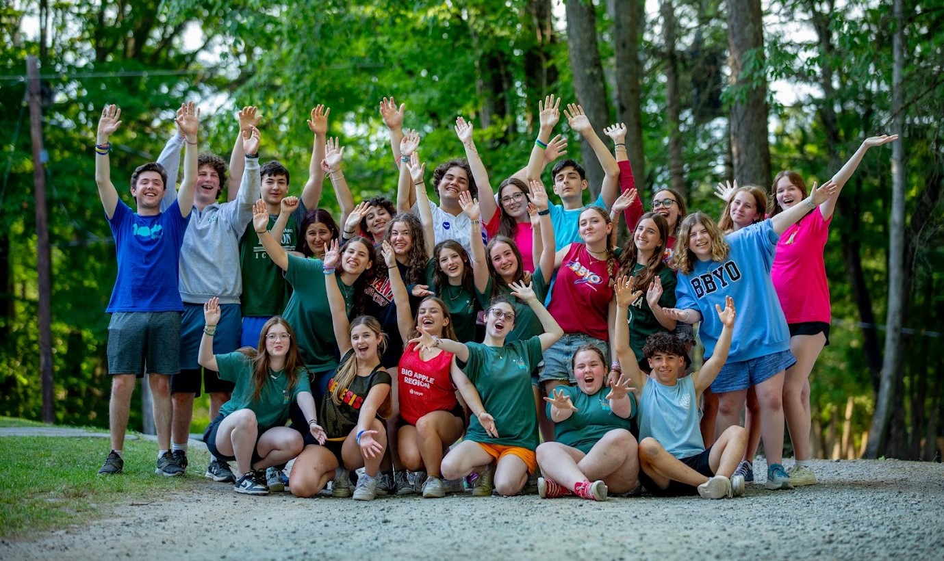 Group of diverse young people smiling at a community event