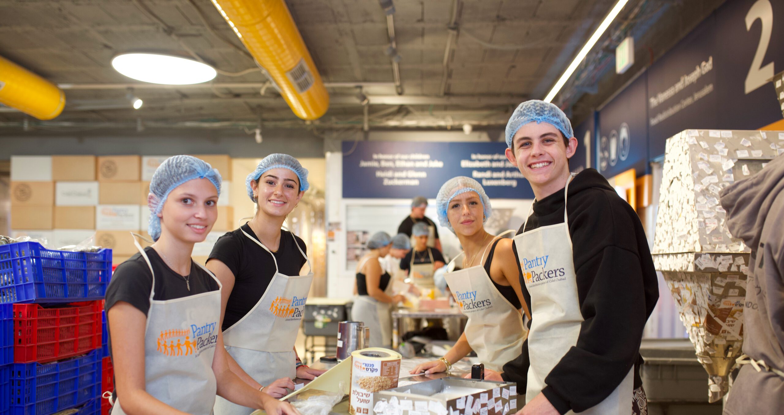 Group of diverse young people smiling at a community event